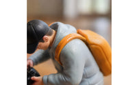 Orange Backpack Bending Male Figurine Light Blue Top Collectible Figure Display Piece for Collectors