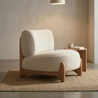 Cushioned Upholstered Lounge Chair Textured Textile Sleek Outline Lounge Chair Rounded Modern Single Sofa Solid Base