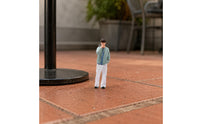 Thoughtful Pose Miniature Figurine Curly-Haired Hand-Painted Figurine