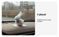Light Luxury Accent Bunny Ornament with Flower Premium Craftsmanship White Porcelain Bunny Statue Elegant Design for Desktop, Car Dashboard