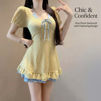 One-piece swimsuit for plus size women with a modest skirted design, short sleeve padded one piece for
