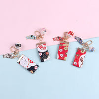 Creative Ceramic Lucky Cat Keychain with Satin Fabric Tassel for New Year Gift Bag Car Charm