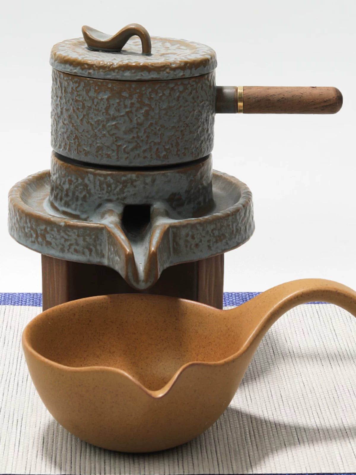 Jubao Tang Lazy Stone Mill Ceramic Tea Set with Rotating Teapot and Automatic Filter