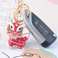 Lion Dance Keychain with Rotating Head, Enamel Painted Lucky Charm for Bags and Keys