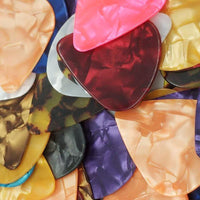 Celluloid & Metal Guitar Picks for Acoustic, Electric, and Bass Guitars