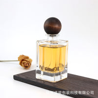 Refillable Clear Glass Perfume Spray Bottle with Wood Ball Cap