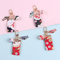 Creative Ceramic Lucky Cat Keychain with Satin Fabric Tassel for New Year Gift Bag Car Charm