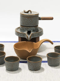 Jubao Tang Lazy Stone Mill Ceramic Tea Set with Rotating Teapot and Automatic Filter
