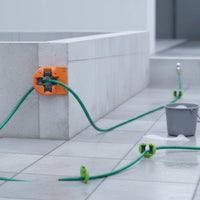 Wall-Mounted Hose Guide Mounting Holes Garden Hose Guide Outdoor Tool Orange Plastic Body
