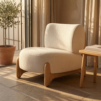 Cushioned Upholstered Lounge Chair Textured Textile Sleek Outline Lounge Chair Rounded Modern Single Sofa Solid Base