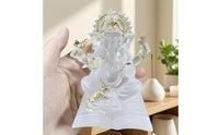 Translucent Elephant-Headed Deity Statue Frosted Seated Deity Figurine Gold-Toned Book Base Statue Molded Detailing