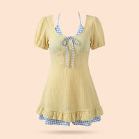 One-piece swimsuit for plus size women with a modest skirted design, short sleeve padded one piece for