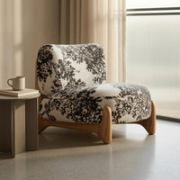 Cushioned Upholstered Lounge Chair Textured Textile Sleek Outline Lounge Chair Rounded Modern Single Sofa Solid Base