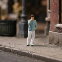 Thoughtful Pose Miniature Figurine Curly-Haired Hand-Painted Figurine