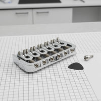 Rotating Saddle Fixed Bridge Long-Lasting Zinc Alloy Rotating Saddle Guitar Bridge Includes Mounting Hardware for Luthiers